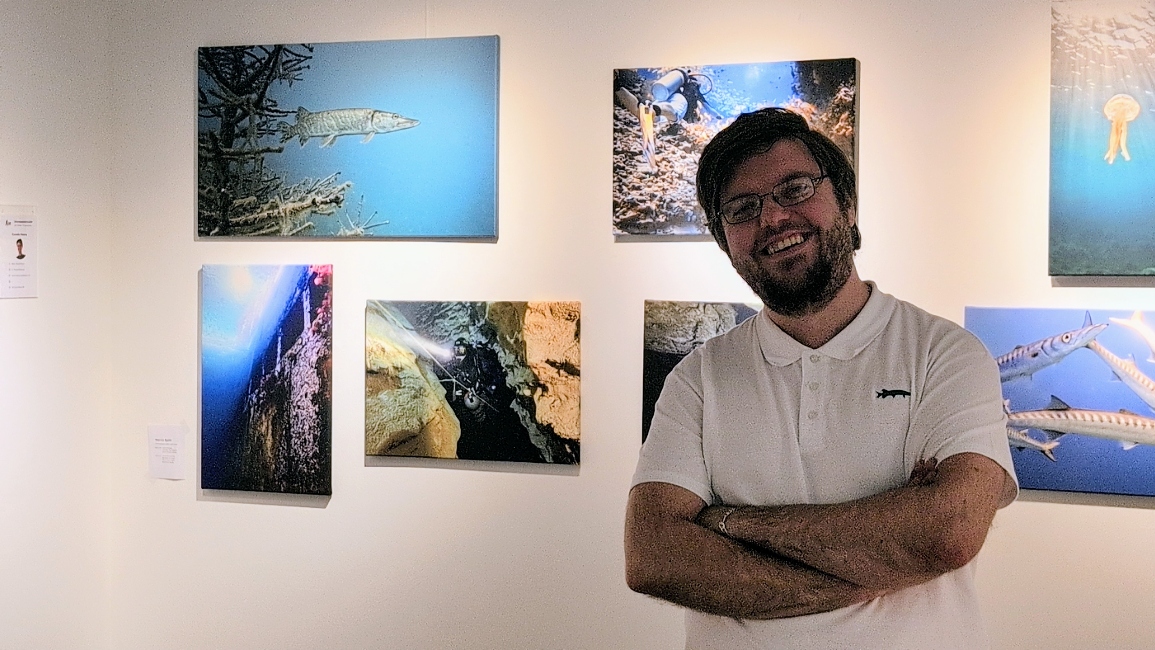 Martin Splitt in front of his photos at the Unterwasser Festival exhibition 2024